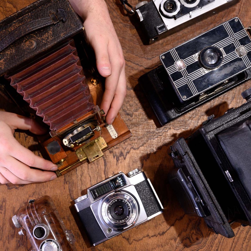 vintage cameras on a desk
